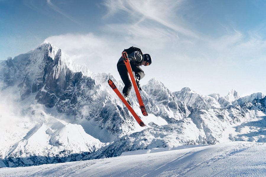 A person jumping in the air on skis.